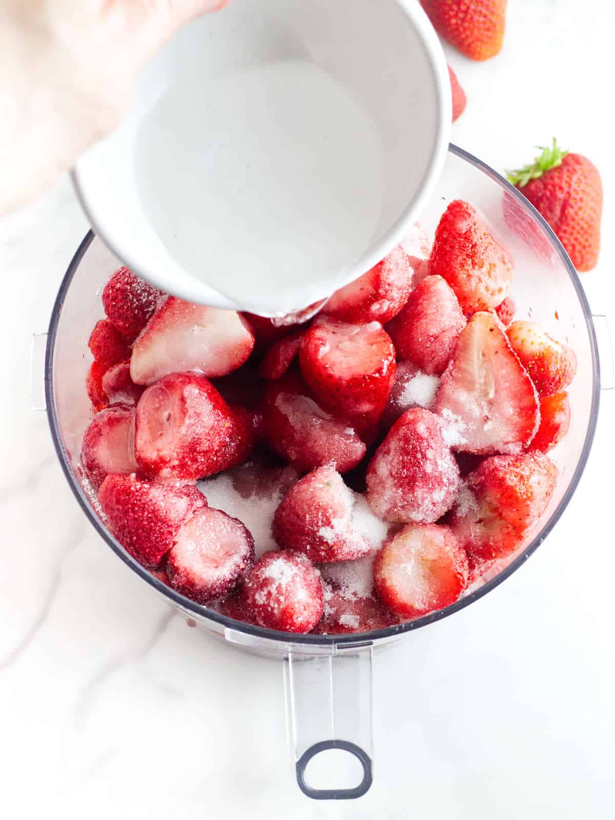 halved strawberries, water, sugar and glycerin in a food processor for pureeing.