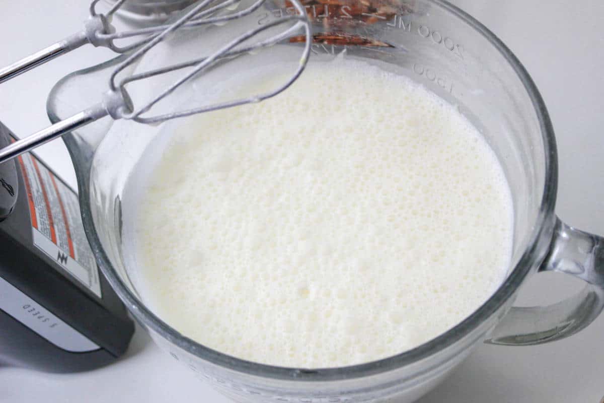 Whipped eggs and cream in a bowl.