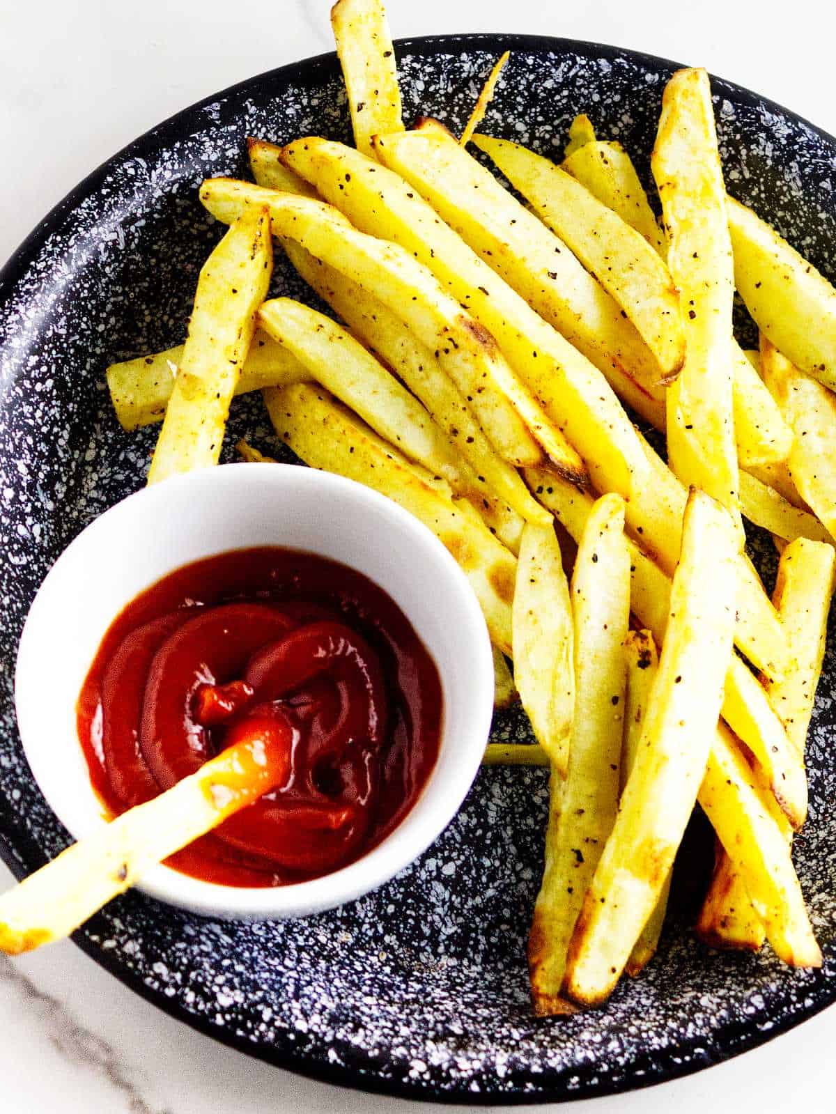 white sweet potato fries with ketchup.