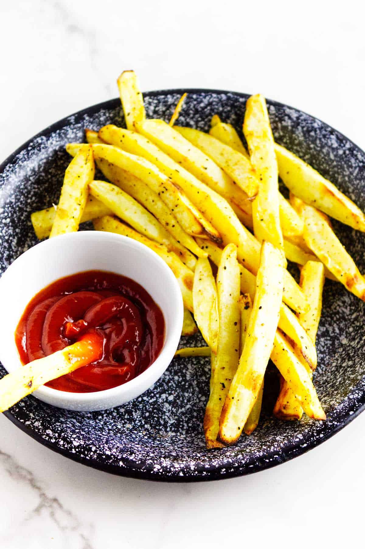 white sweet potato fries with ketchup.