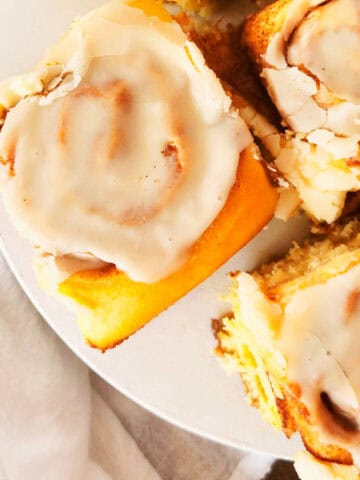 baked cinnamon rolls on a plate.