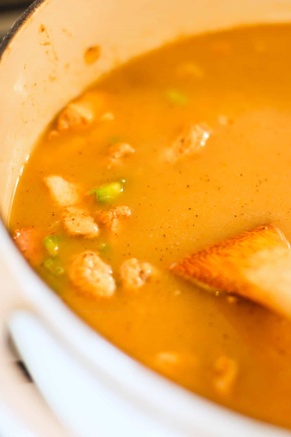 Chicken broth added to vegetable and meat mixture.