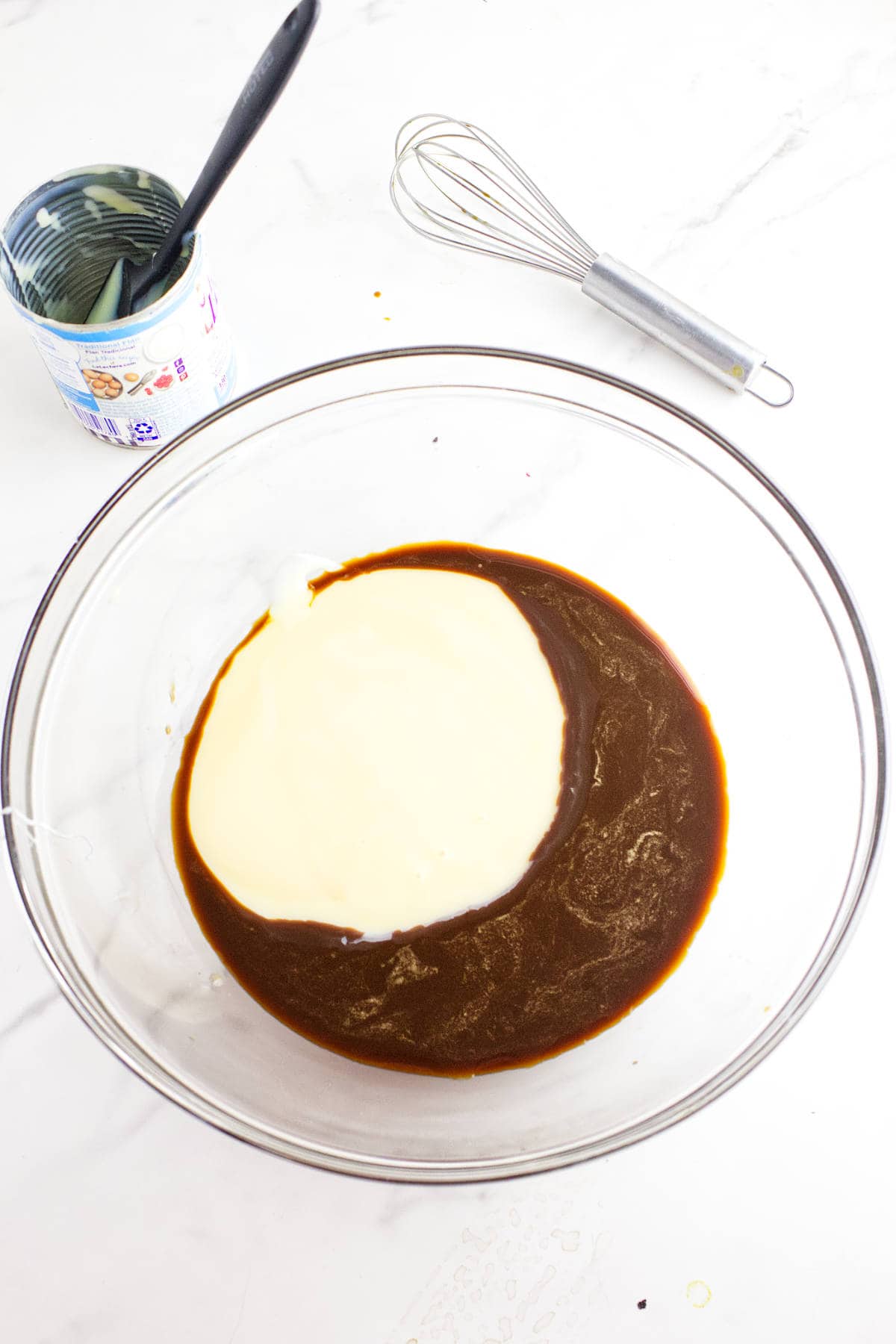 mixing sweetened condensed milk with ingredients in a bowl.