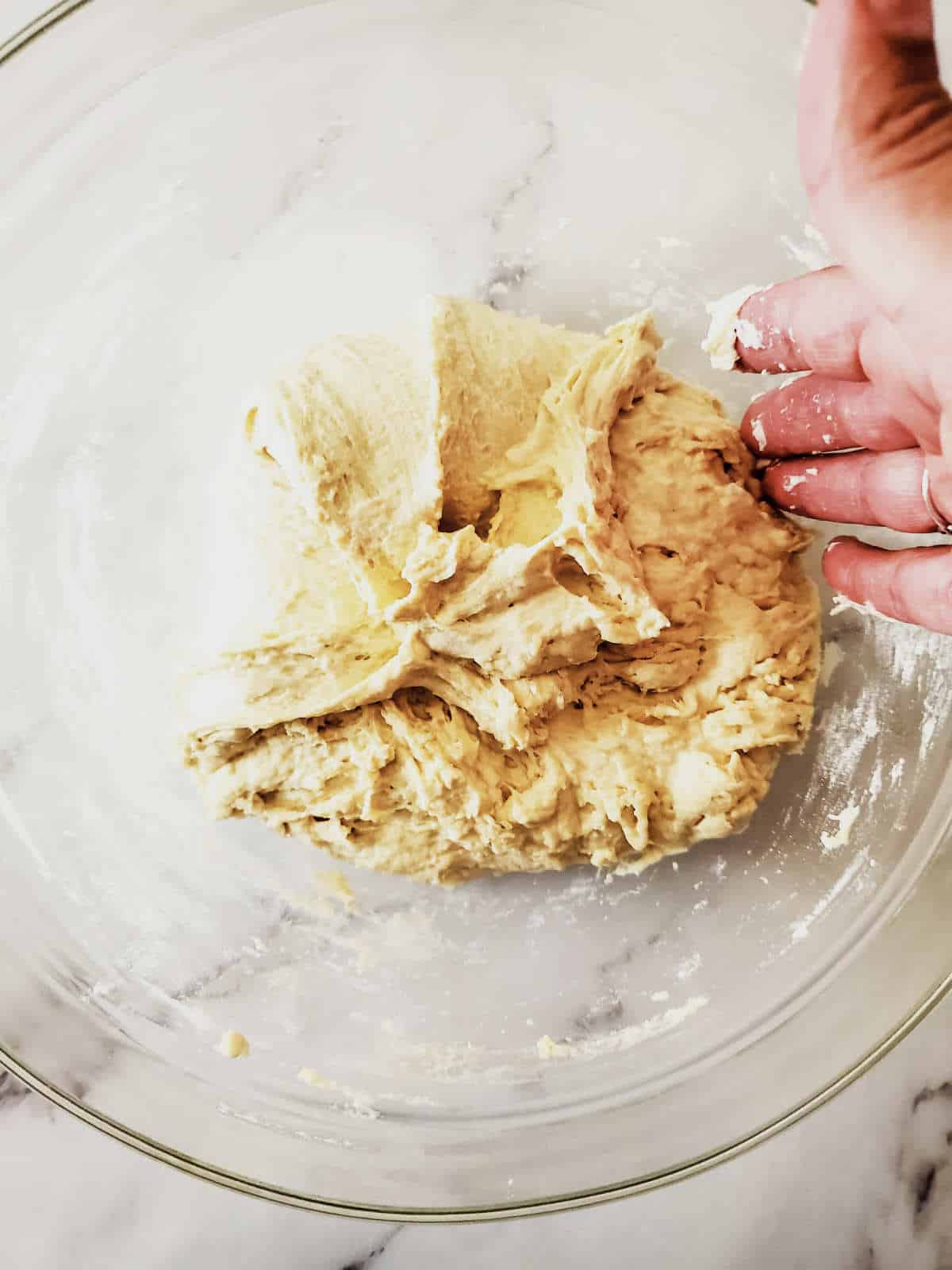 kneading dough to develop gluten.