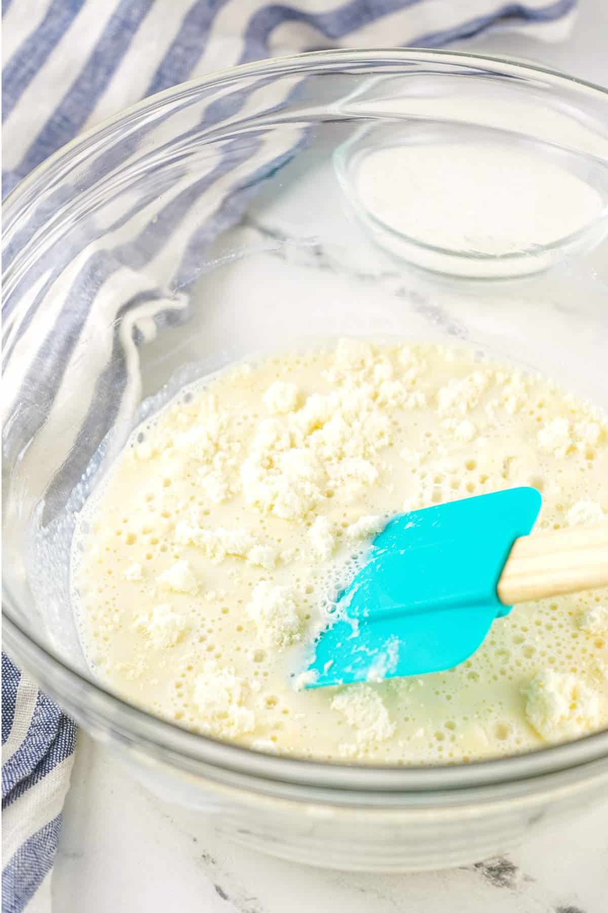 whisking powdered milk, sugar, and hot water until clumps break up.