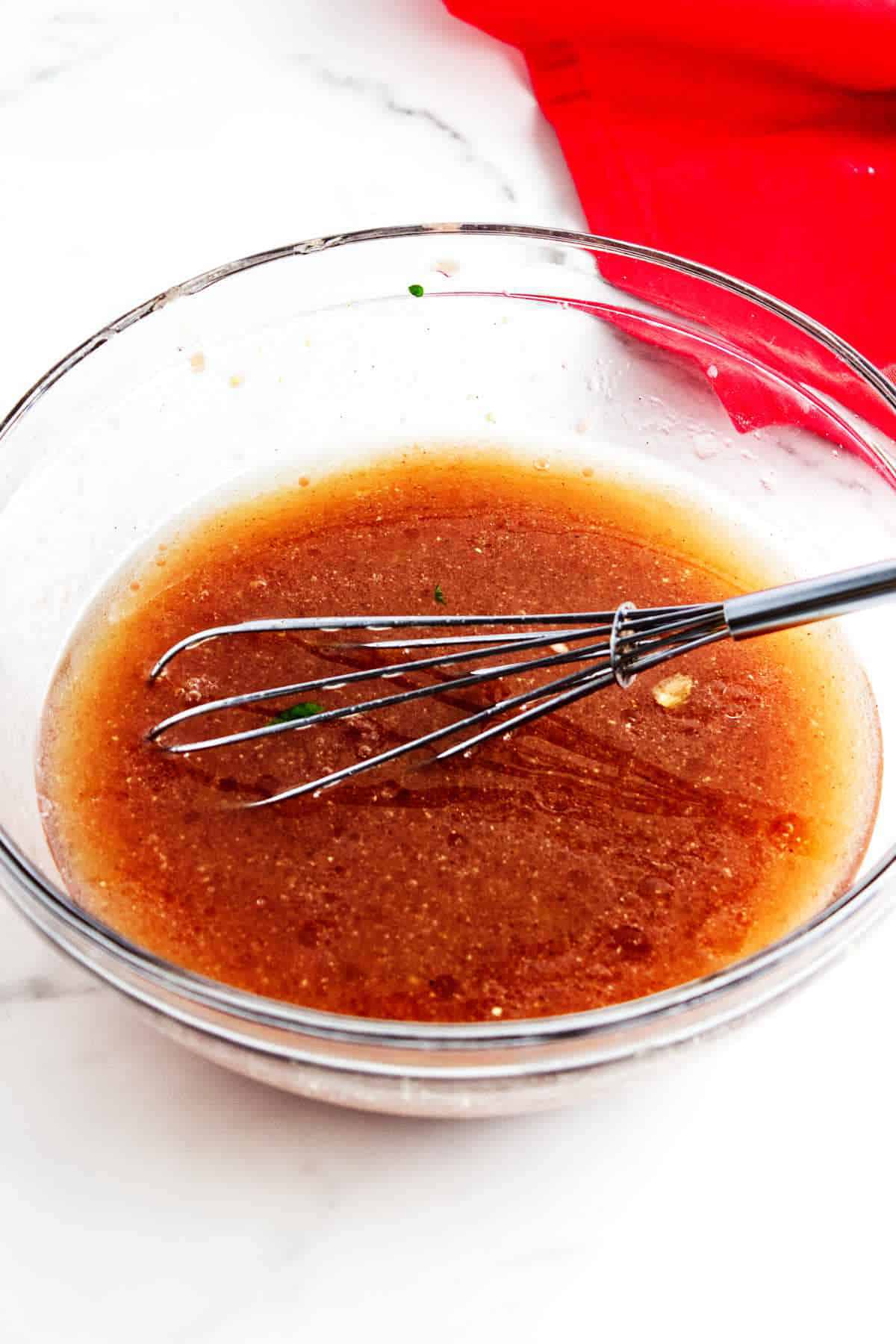 red wine salad dressing in a bowl.