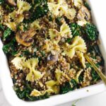 serving bowl of kasha varnishkes with mushrooms and kale.