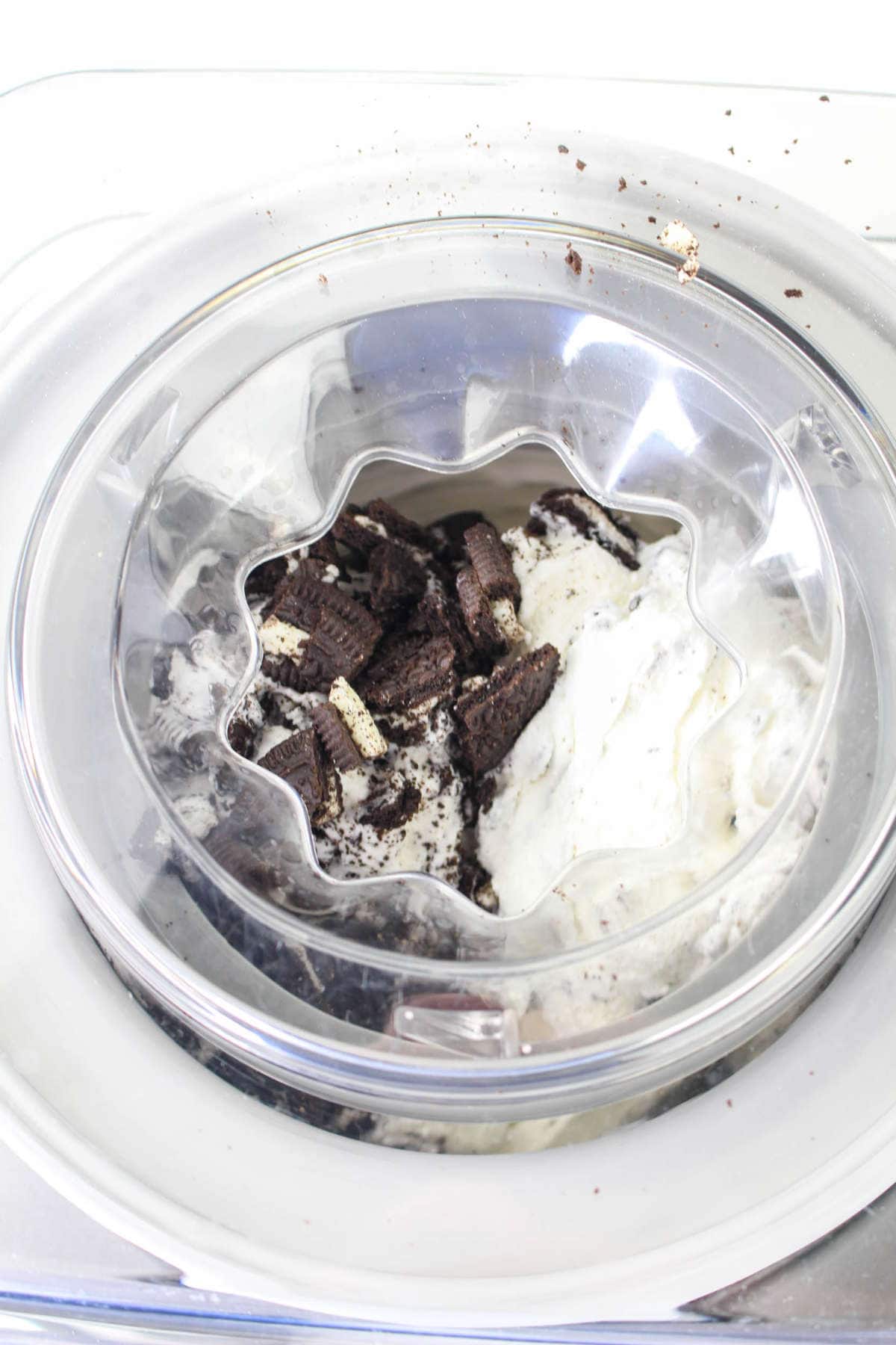 Mixing cookies into the ice cream while churning in the Cuisinart Ice Cream Maker.