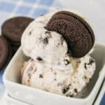 Oreo cookies ice cream in a bowl with a cookie on top.