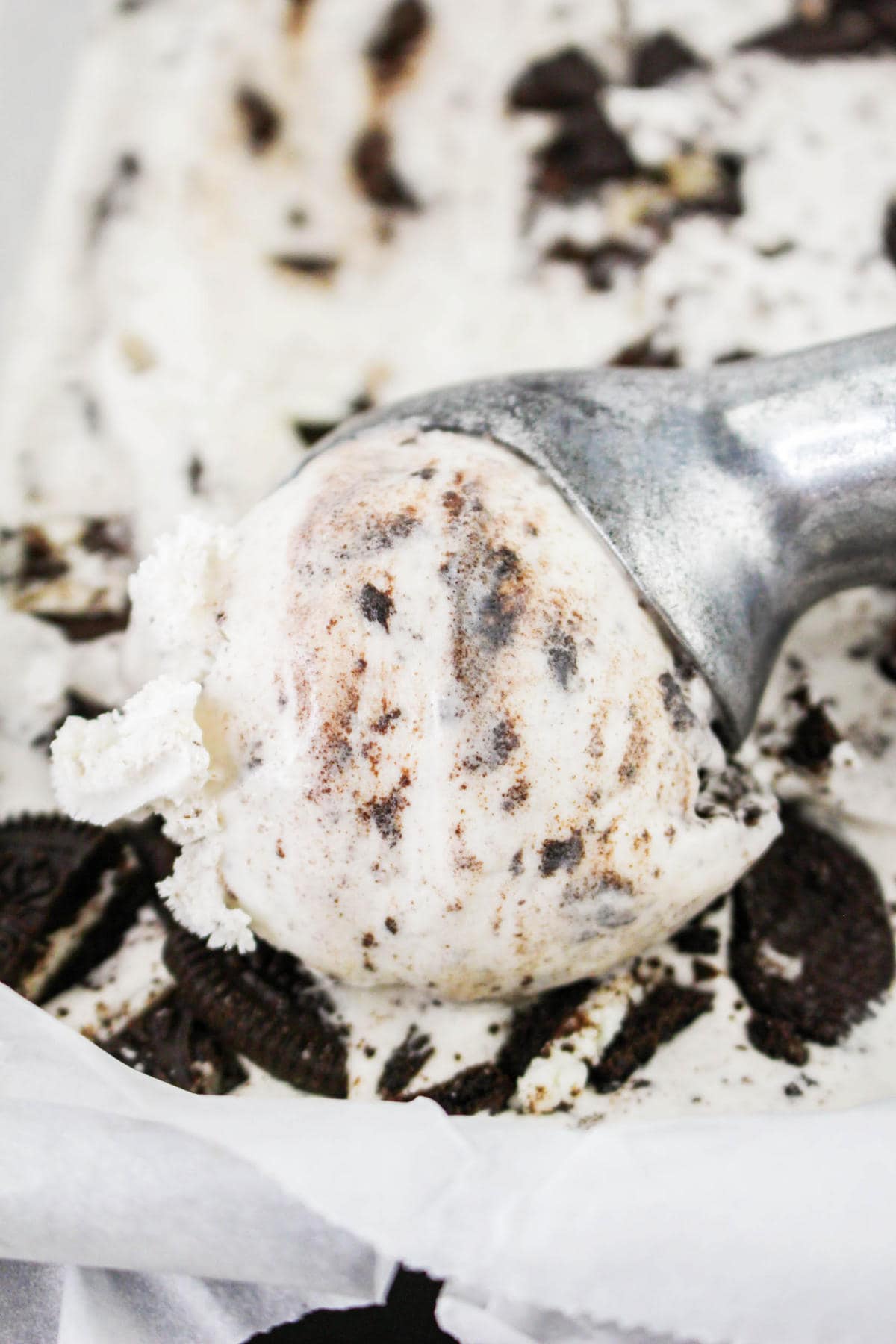 scooping up ice cream with an ice cream scoop.