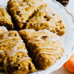 Maple icing drizzled on pumpkin spice scones.