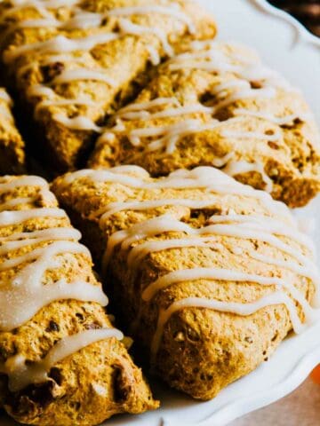 Maple icing drizzled on pumpkin spice scones.