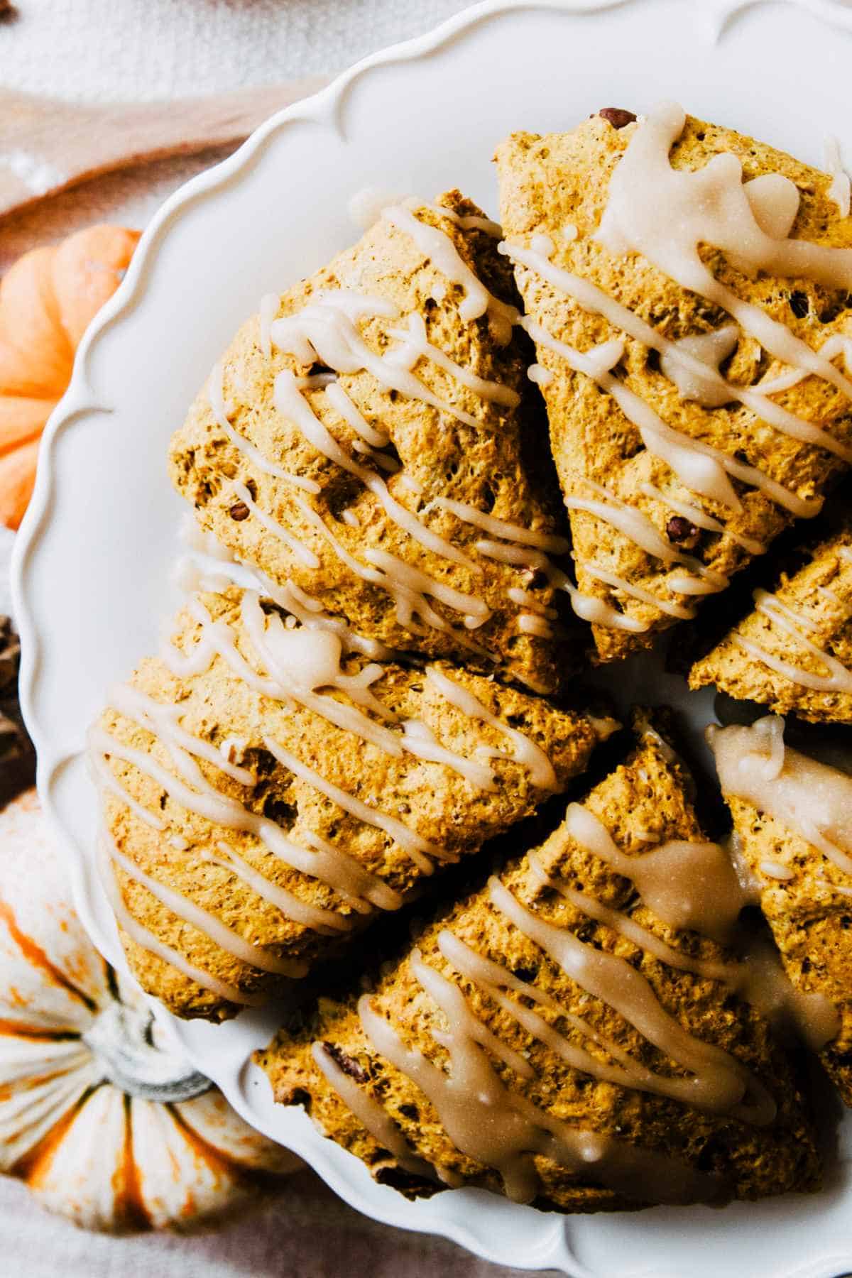 Maple icing drizzled on pumpkin spice scones.