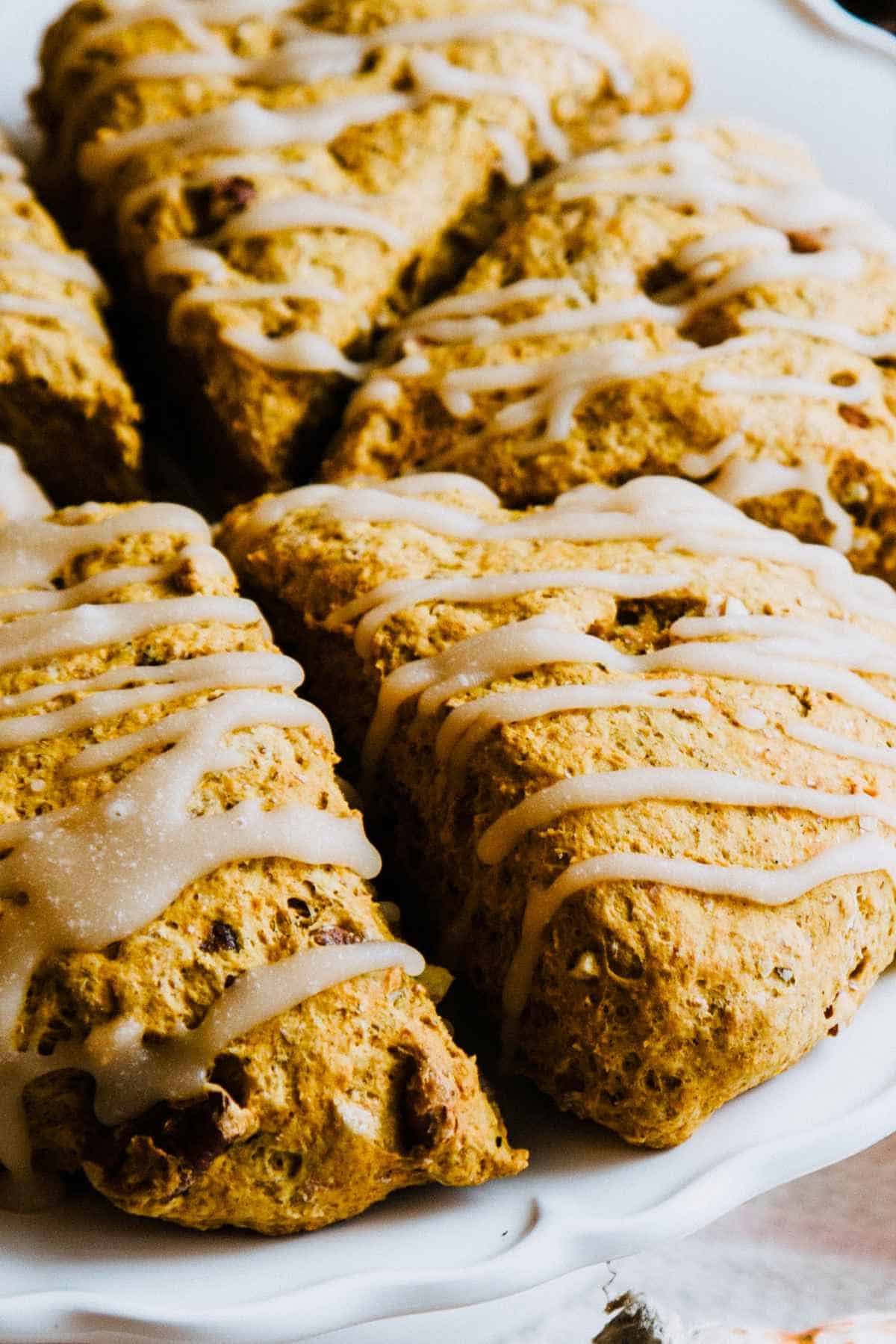 Maple icing drizzled on pumpkin spice scones.