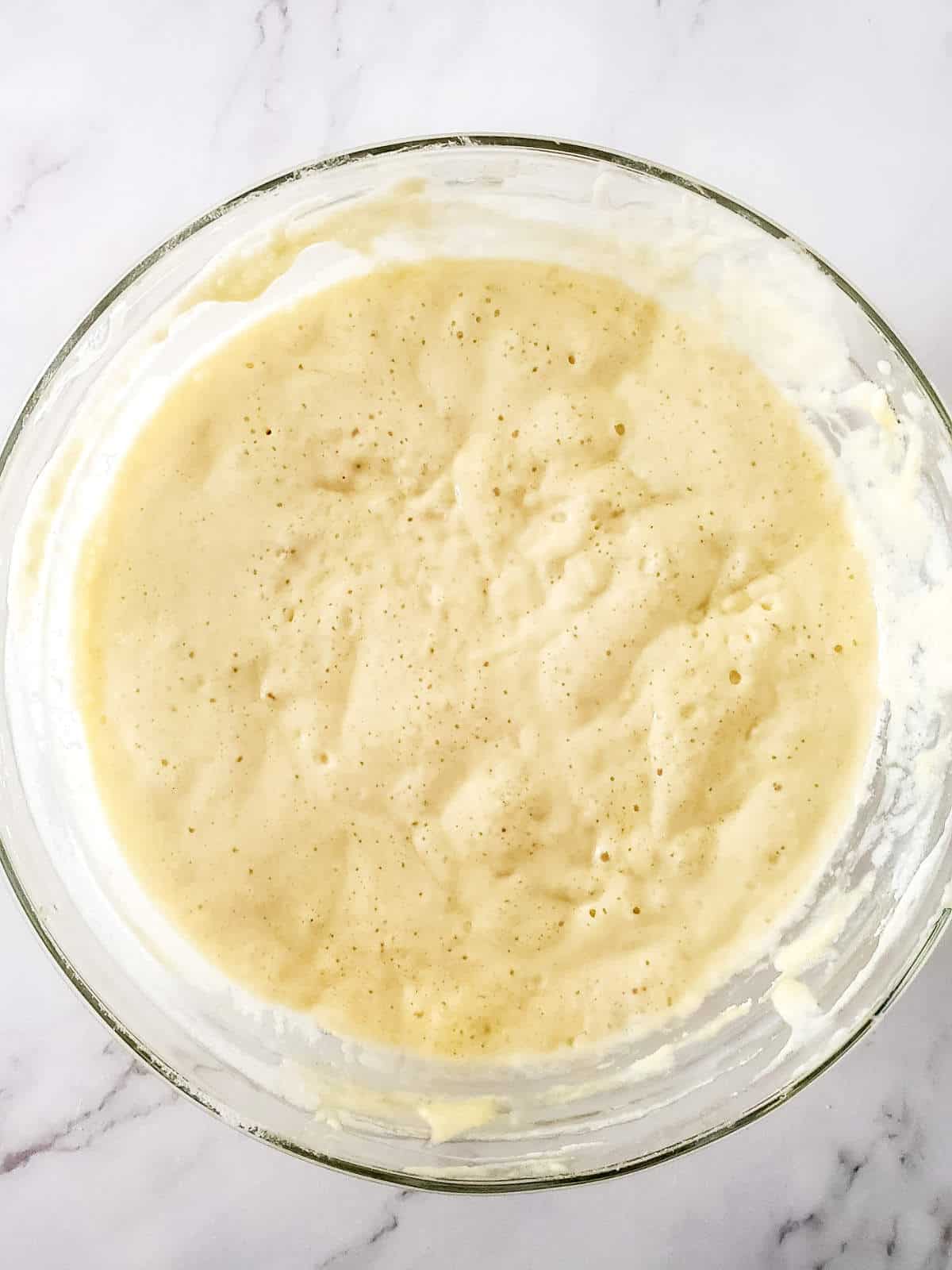 sourdough discard pancake batter all bubbly in a bowl.