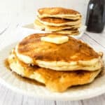 stack of sourdough discard pancakes with butter and syrup.