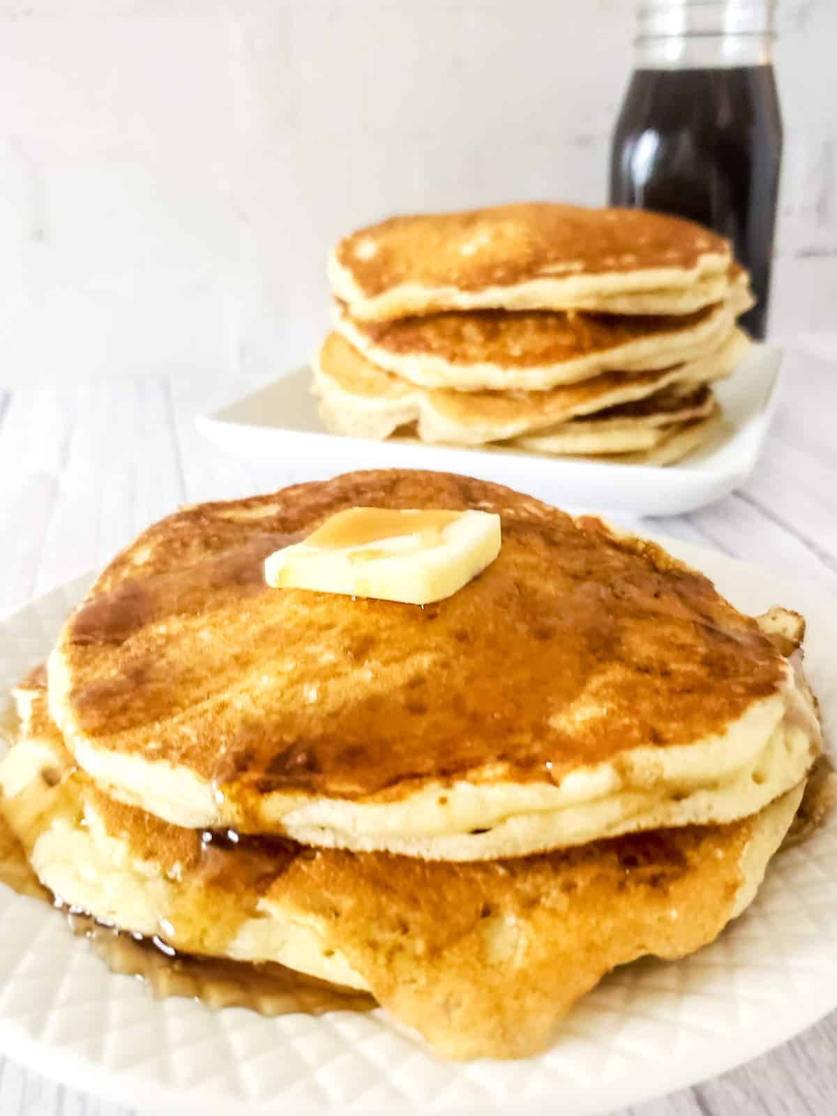 stack of sourdough discard pancakes with butter and syrup.