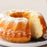 Vanilla Bundt cake with slice cut out.