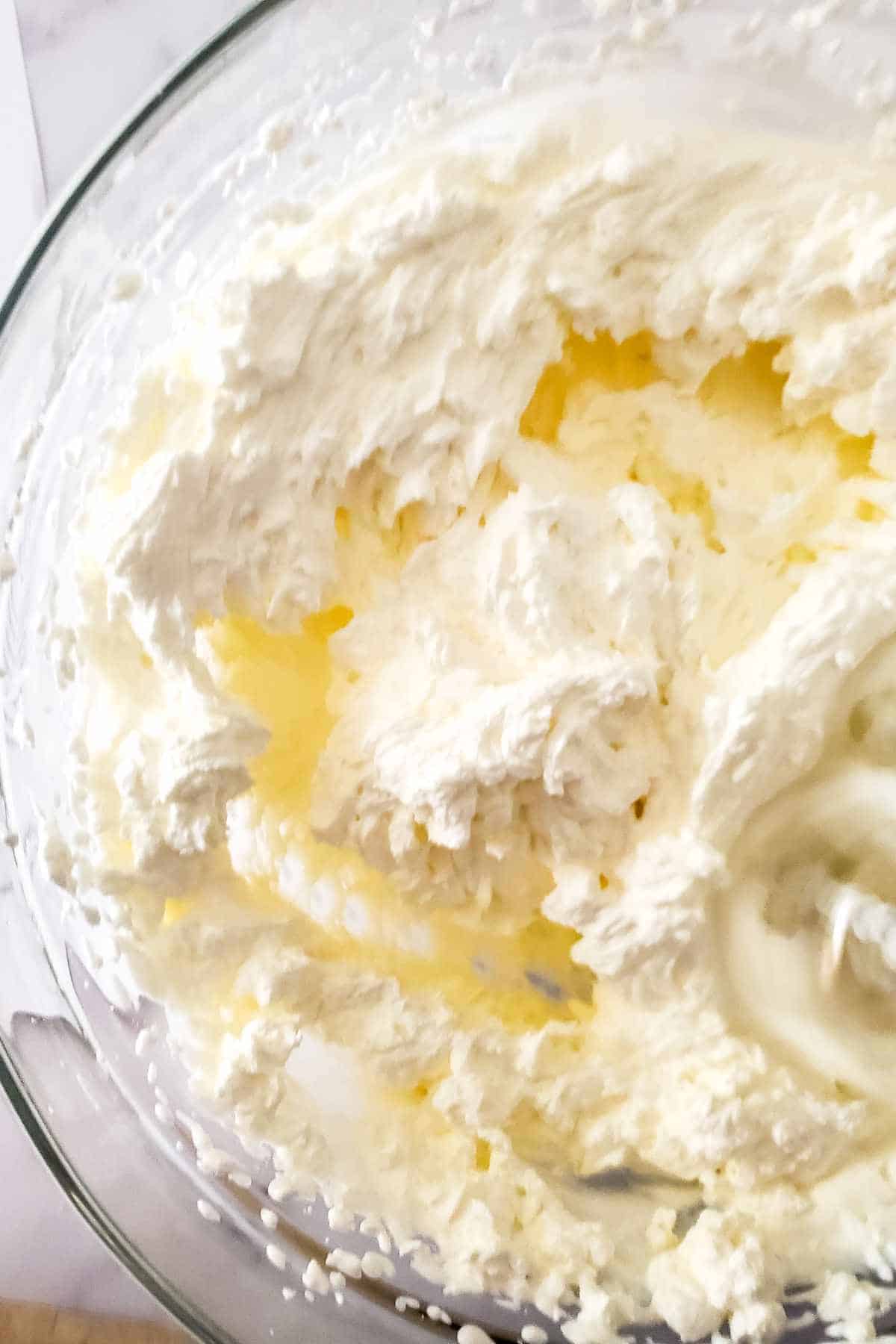 Whipped cream stage before separating into butter and buttermilk.