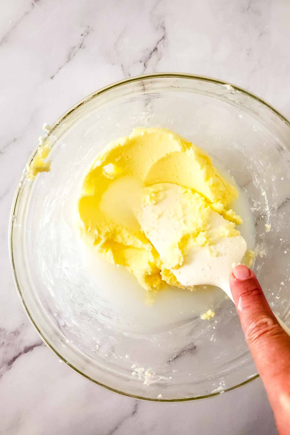 Pressing butter to remove remaining buttermilk after churning.