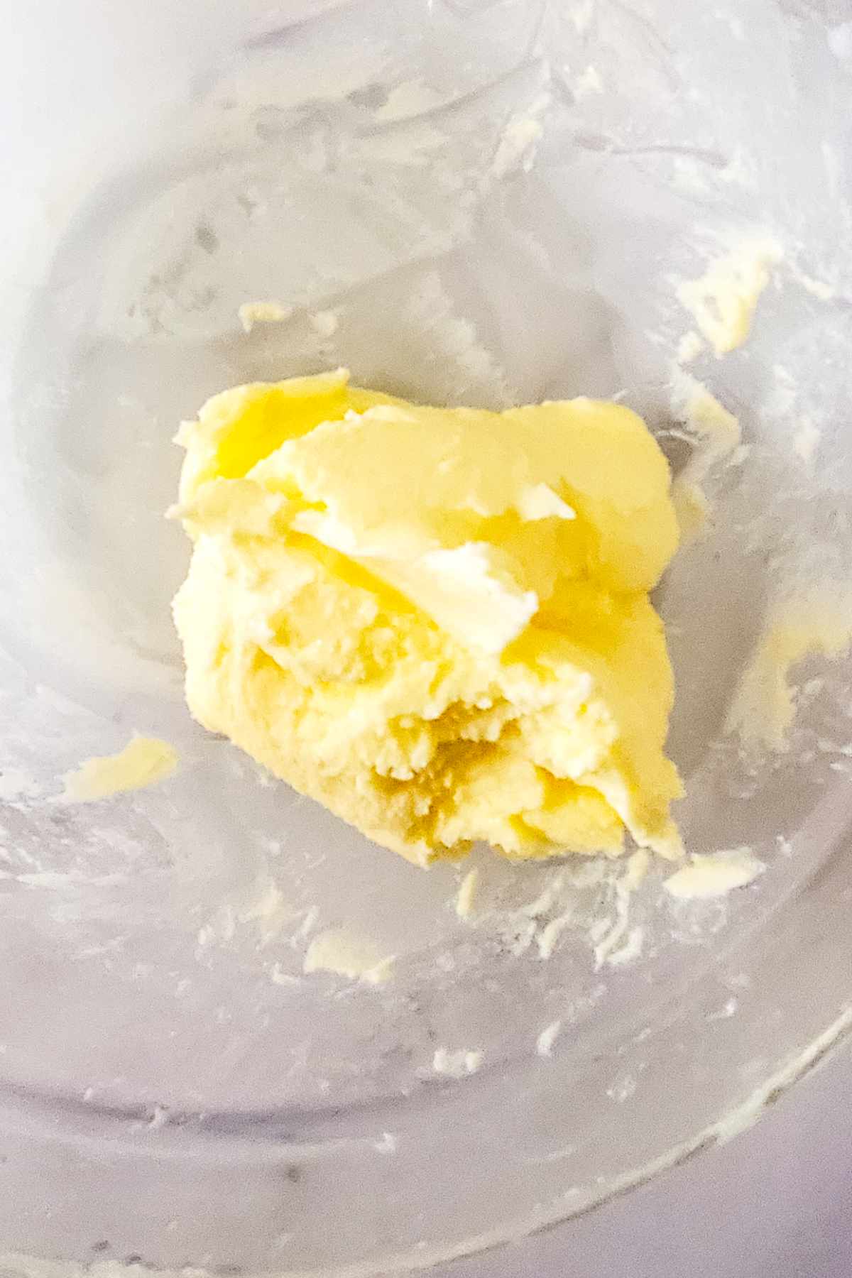 Washing butter in cold water to remove remaining buttermilk.