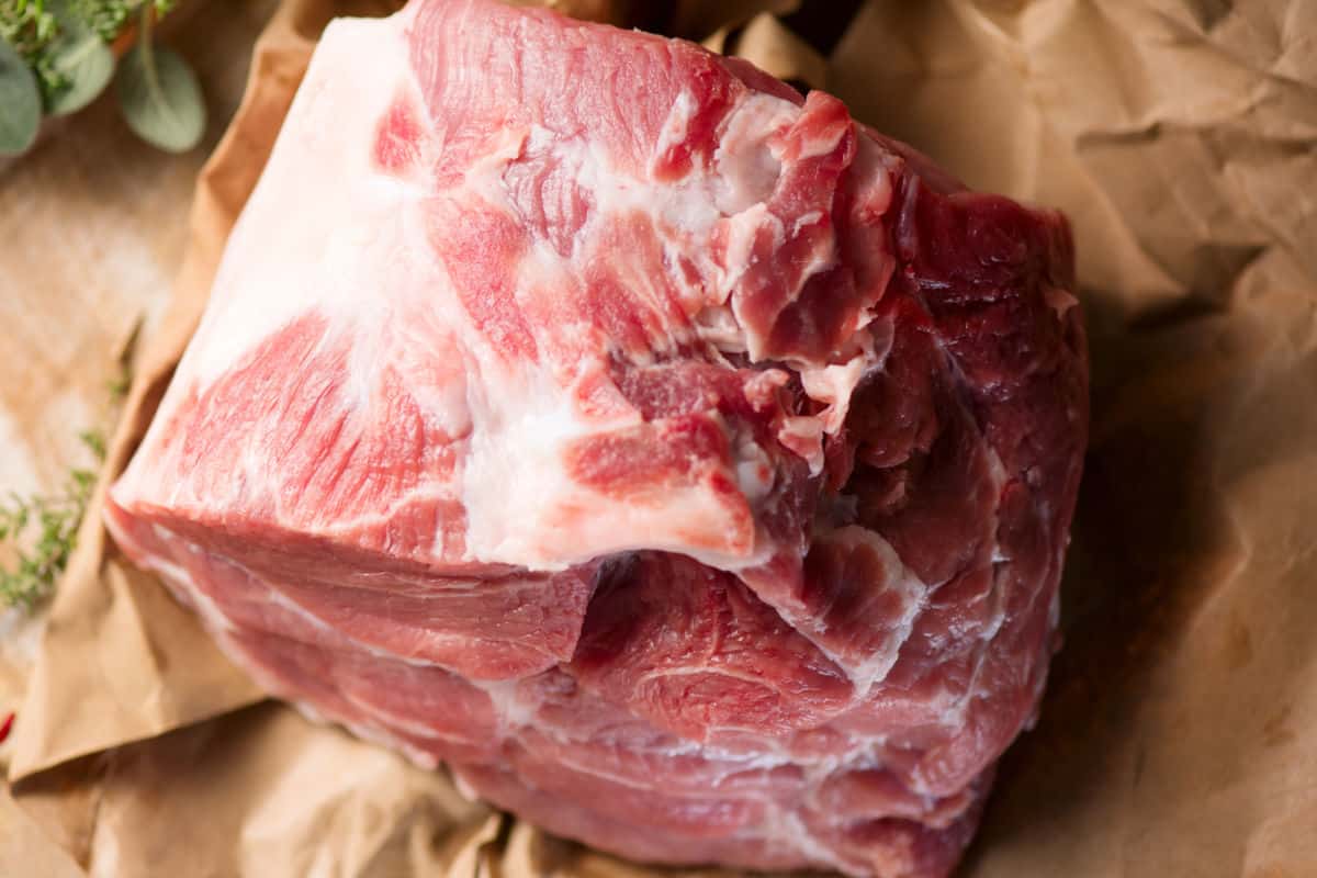 Raw pork butt roast on butcher paper before cooking in the Instant Pot.