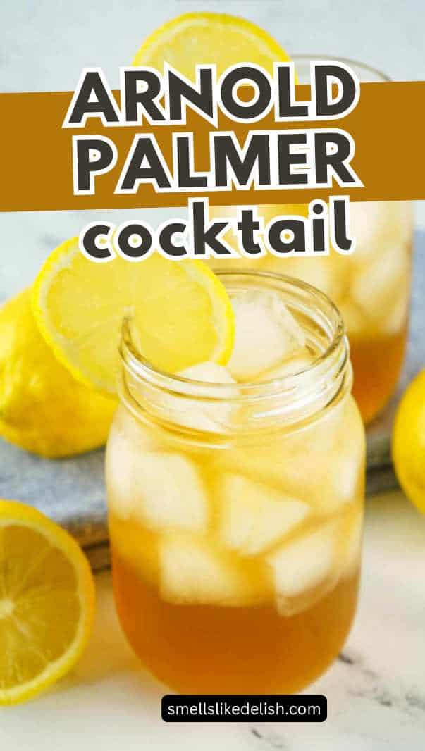 A mason jar filled with iced tea and ice cubes, garnished with a lemon slice on the rim. A whole lemon and another lemon slice are visible in the background.