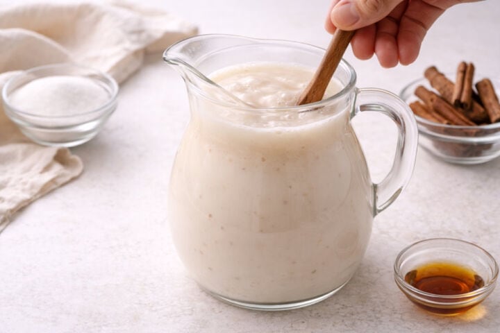 Pitcher of freshly mixed horchata served over ice.