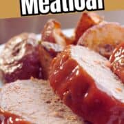 Three slices of ketchup topped meatloaf with roasted potatoes.