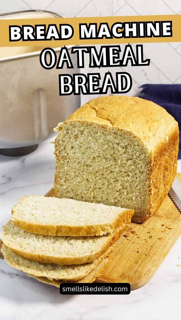 A loaf of oatmeal bread, partially sliced, sits on a wooden cutting board next to a bread machine. Text overlay reads "Bread Machine Oatmeal Bread.