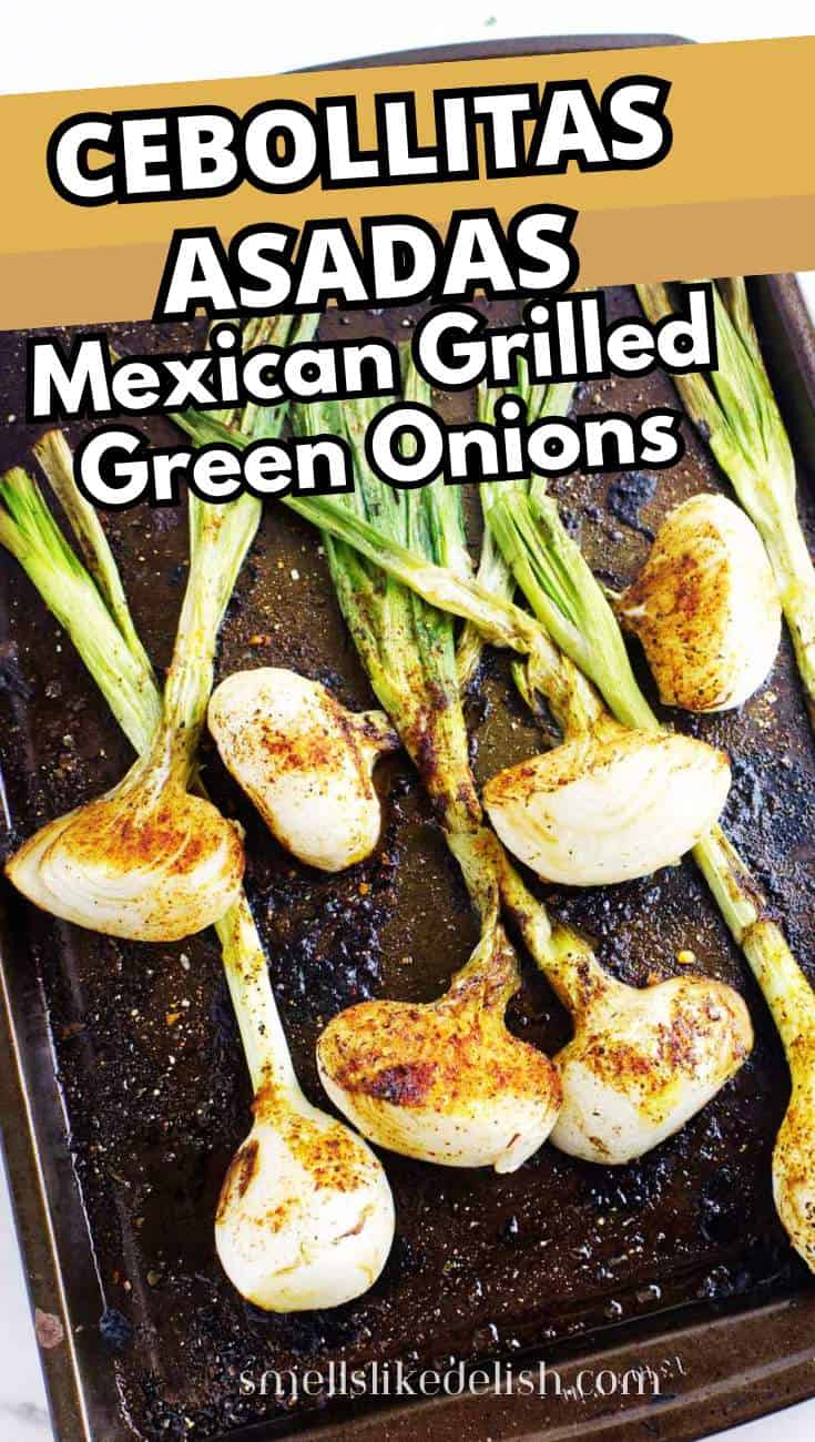 Grilled green onions with charred, seasoned bulbs and green tops are arranged on a dark baking sheet. Bold text reads "Cebollitas Asadas, Mexican Grilled Green Onions.