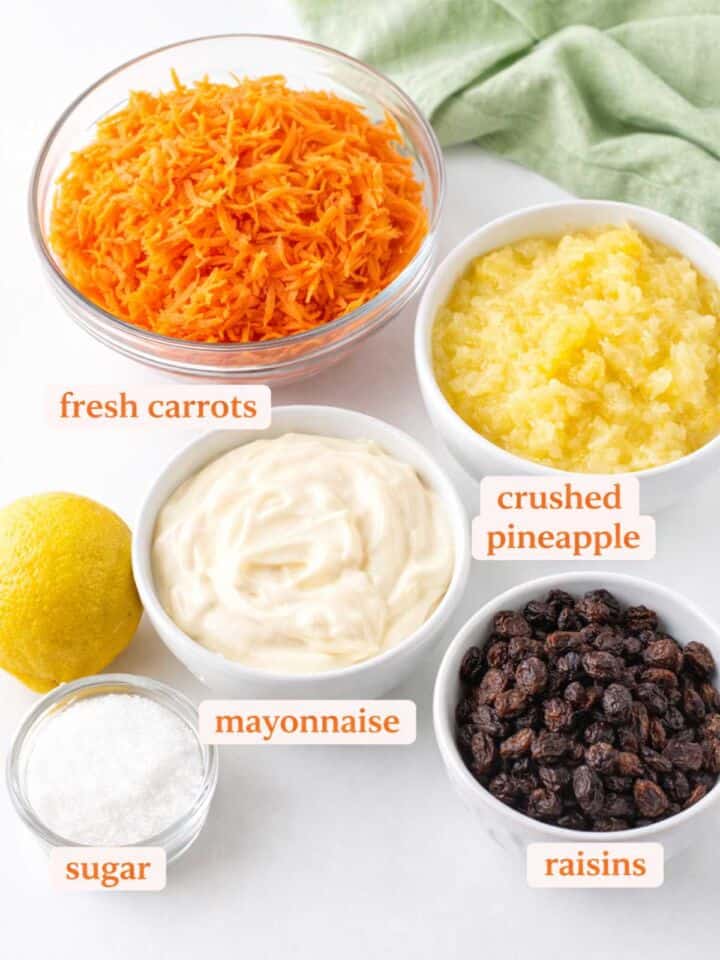 Ingredients for the original Chick-fil-A carrot raisin salad recipe with shredded carrots, crushed pineapple, mayonnaise, raisins, and sugar.