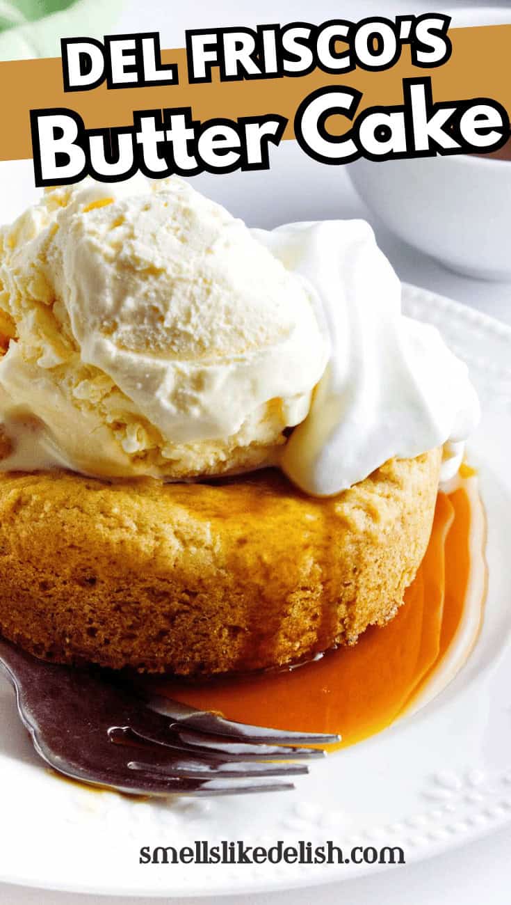 A golden butter cake topped with a scoop of vanilla ice cream and whipped cream, served on a white plate with caramel sauce and a fork. Text overlay reads "Del Frisco's Butter Cake" and "smellslikedelish.com".
