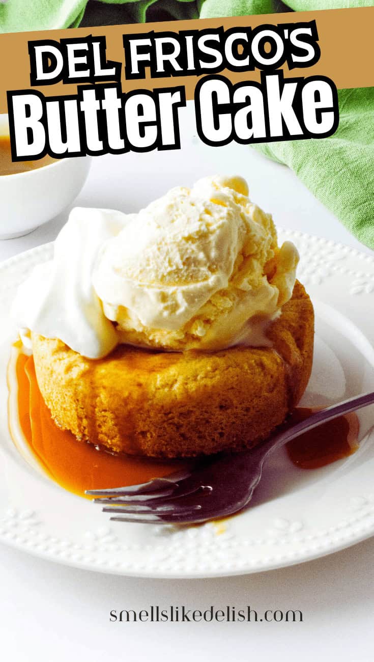 A round butter cake topped with a scoop of vanilla ice cream and whipped cream sits on a white plate with caramel sauce, a fork, and part of a green napkin visible. Text reads "Del Frisco's Butter Cake.