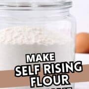 A glass jar filled with flour sits on a white surface beside eggs. Bold text over the image reads, "Make self rising flour at home." The website "smellslikedelish.com" is at the bottom.