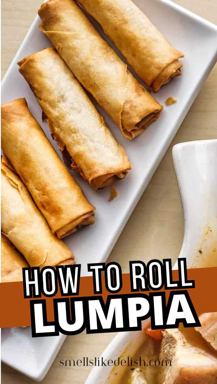Four golden-brown lumpia rolls are neatly arranged on a white rectangular plate. Text overlay reads "How to Roll Lumpia" above the website name "smellslikedelish.com.