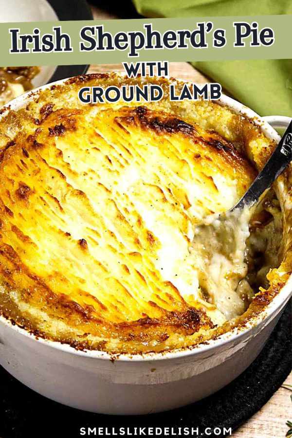 A golden-brown Irish Shepherd's Pie with mashed potato topping, partially scooped out to reveal the ground lamb filling, in a white baking dish. Text on image reads