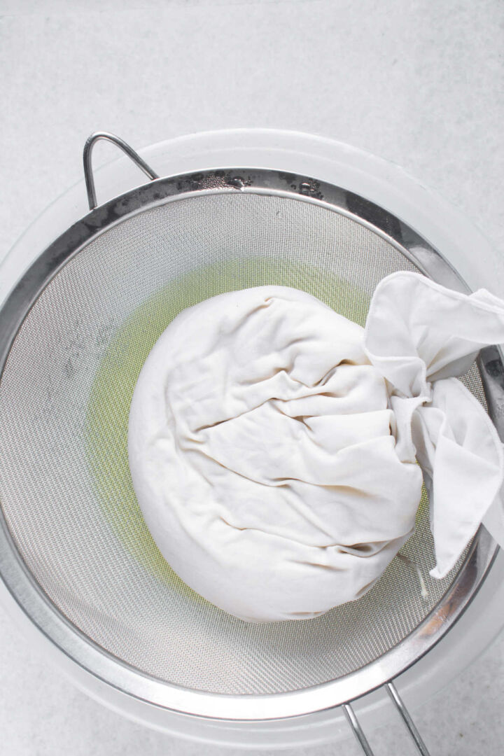 Yogurt wrapped in cheesecloth before straining.