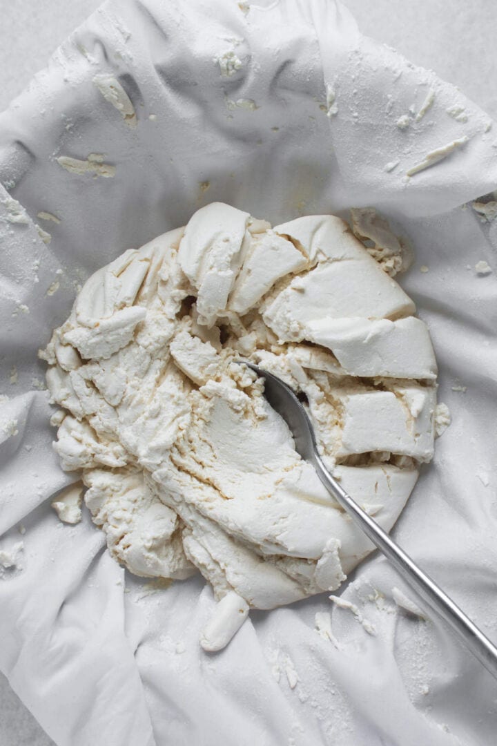 Yogurt draining through cheesecloth.