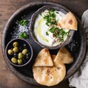 Lebanese labneh served with pita bread and olives.
