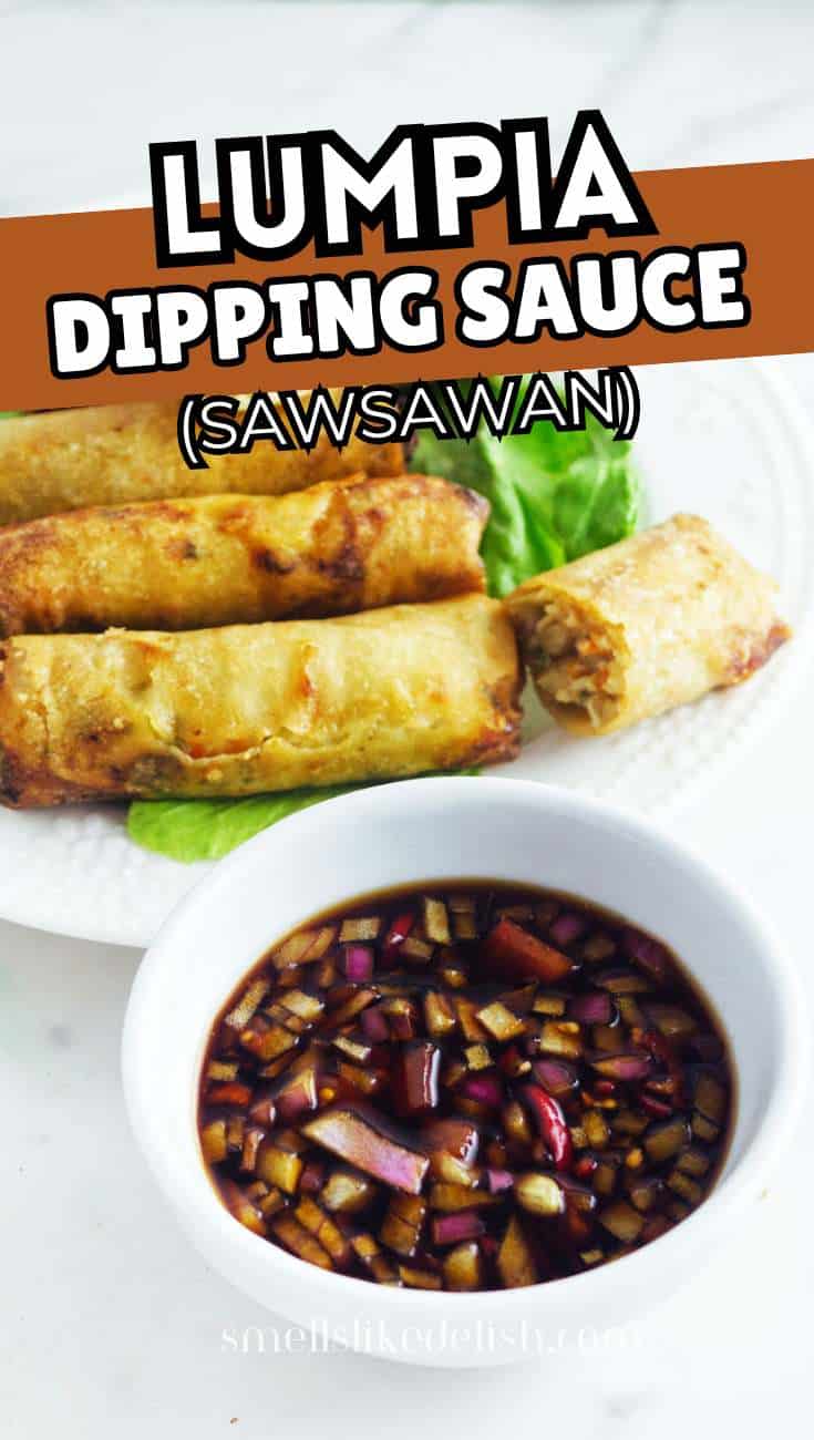 Three fried lumpia rolls are served on a white plate with lettuce, next to a bowl of dark dipping sauce containing chopped red onions and green chili peppers. Text above reads: "Lumpia Dipping Sauce (Sawsawan).
