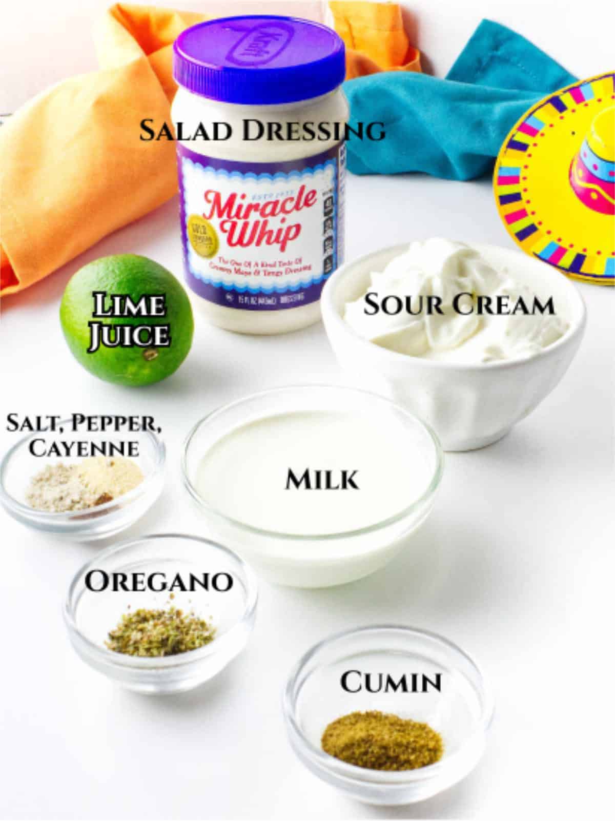 Mexican white sauce ingredients with Miracle Whip, sour cream, lime juice, milk, and spices.