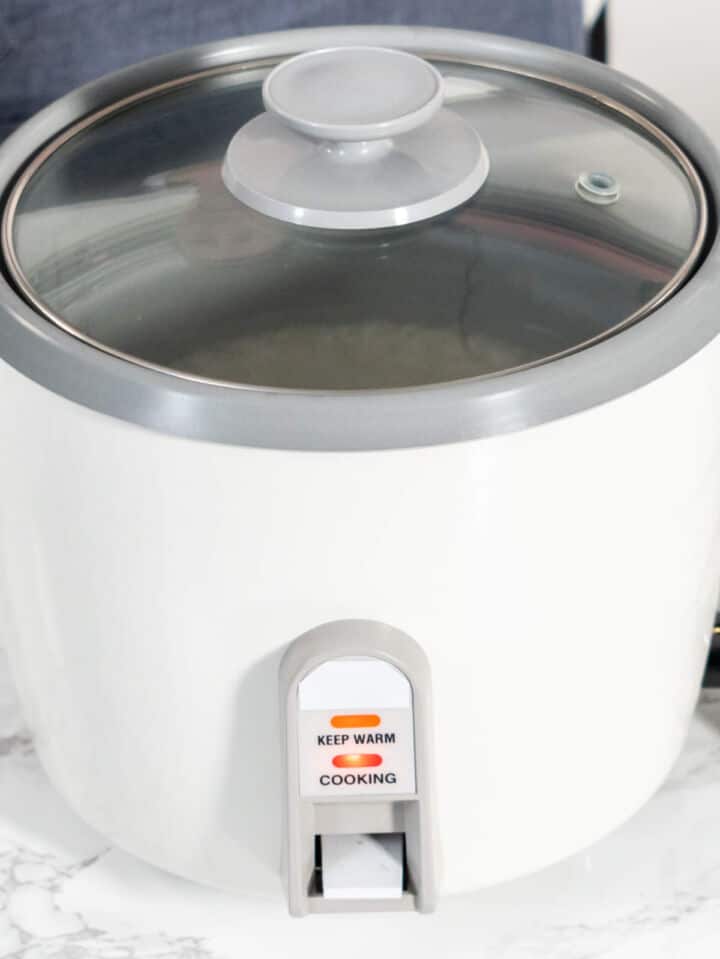 Rice cooker set to cook basmati rice using the white rice setting.