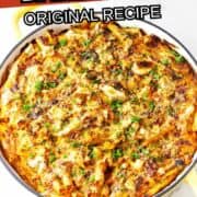 Overhead view of a baked ziti casserole in a yellow dish, topped with melted cheese and chopped parsley. Text on image reads: "San Giorgio Baked Ziti Original Recipe" and "smellslikedelish.com.