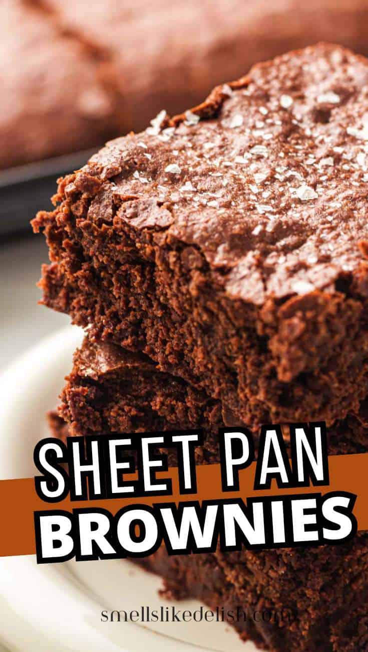 Stacked fudgy sheet pan brownies on a plate with text overlay Sheet Pan Brownies.