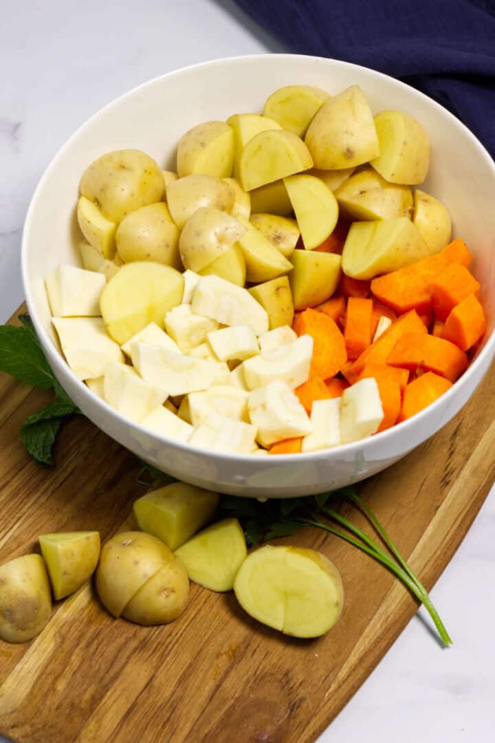 Chopped potatoes, carrots, and parsnips prepared for Irish lamb stew.