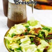 A bowl of chopped lettuce salad topped with brown ginger carrot dressing, with a glass bottle of dressing and text reading "Japanese Steakhouse Ginger Carrot Dressing" above the salad.