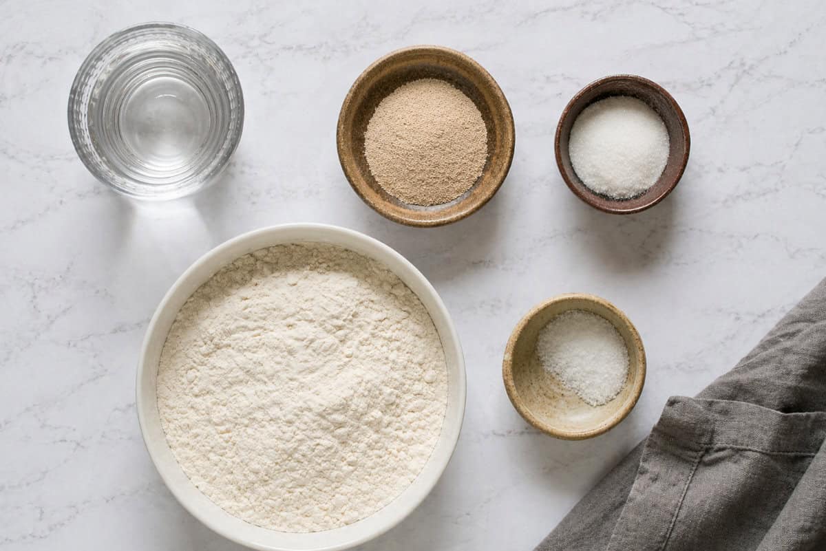 Bolillo ingredients with flour yeast water and salt.