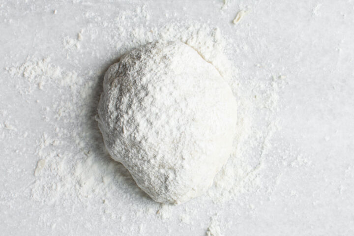 Dough ball on floured surface to be lightly kneaded.
