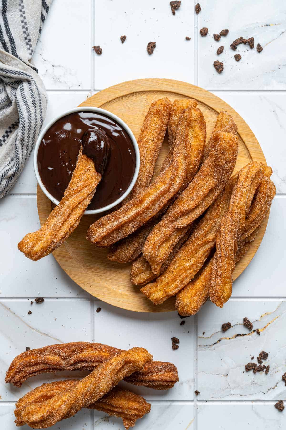 Authentic Mexican churros coated in cinnamon sugar with chocolate sauce.